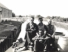 15 Thomas Murphy Junior seated at front outside Lowtown Boatyard 1950s © Conroy Collection